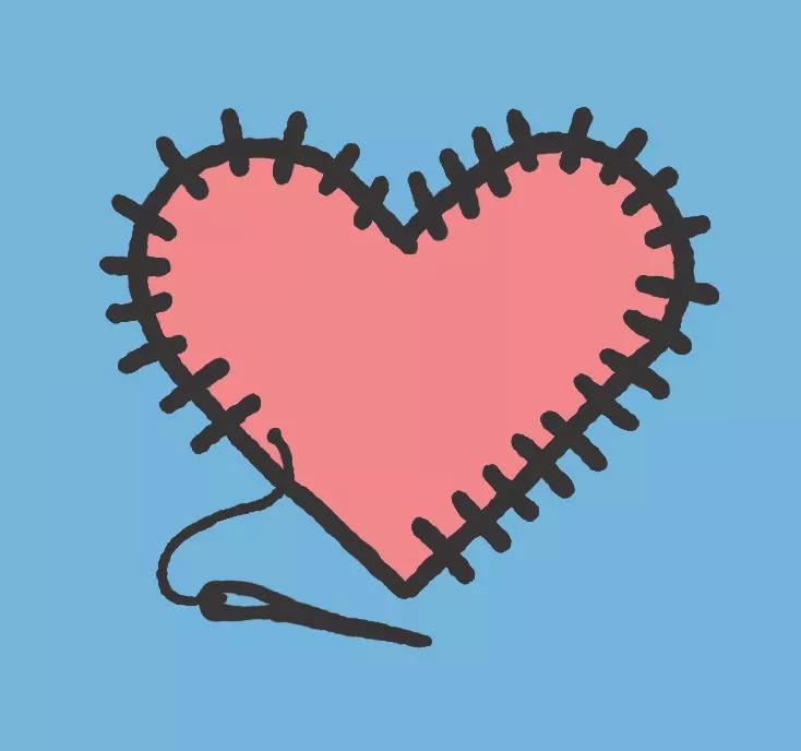 Corazón cosido con aguja e hilo.